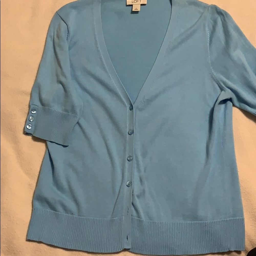 Cute v-neck short sleeve light blue cardigan.